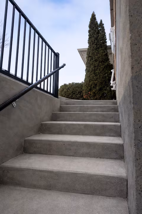 Outside staircase, photographed looking up from the basement entrance